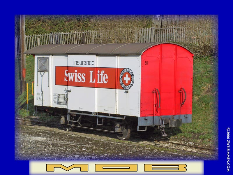 Gk511: MOB advertising boxcar 'Swiss Life' insurance, at _____, March 30, 2003, 0942