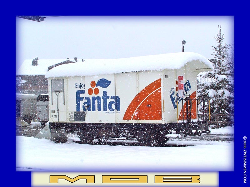 Gk513: MOB advertising boxcar 'Fanta', RH side, in snowstorm, at Schönried, April 10, 2003, 1221