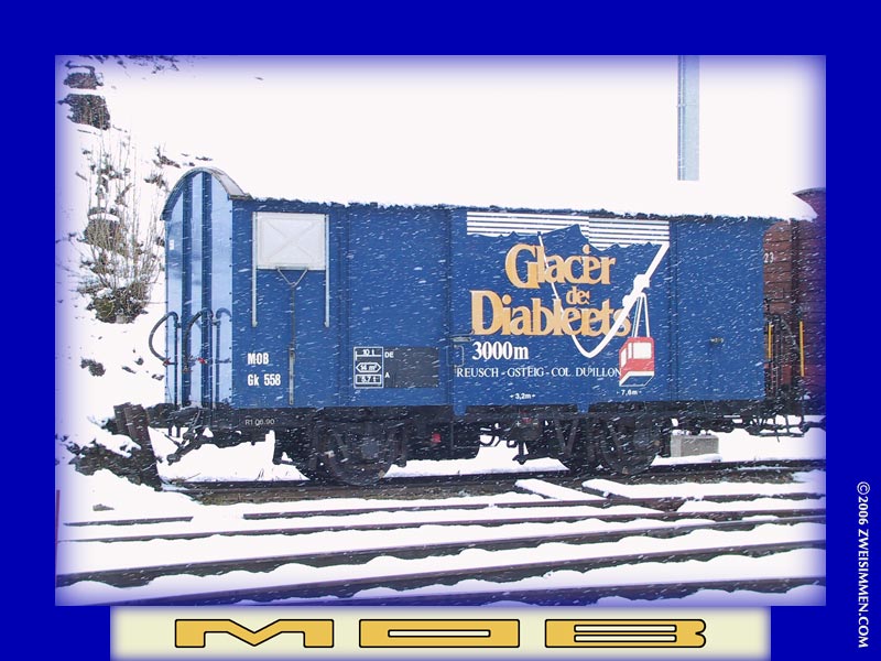 Gk558: MOB advertising boxcar 'Glacier de Diablarets', at Gstaad, in a snowstorm, 2___