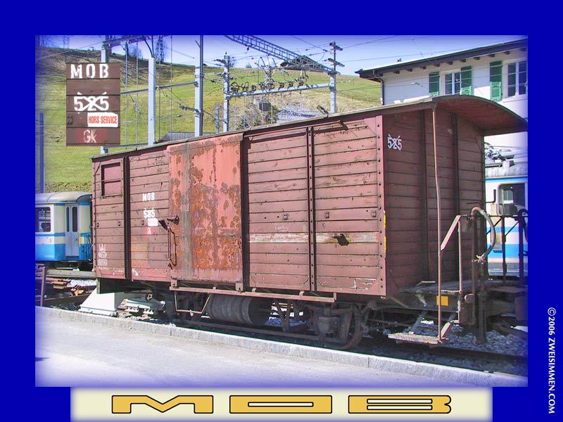 Gk525: MOB boxcar, out of service, at Zweisimmen, April 13, 2003, 1135