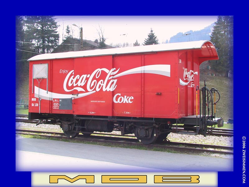 Gk530: MOB advertising boxcar 'Coca Cola', at Gstaad, April 17, 2003, 1438