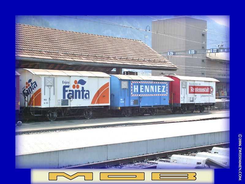 Three MOB advertising boxcars: Gk513 Fanta, Gkv560 Henniez & Gk511 Rentenanstalt; at Zweisimmen, October 21, 2005