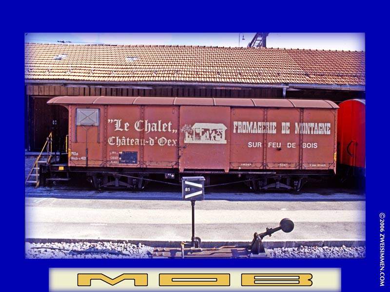 Hack-v 401: MOB advertising 4-axle boxcar 'Le Chalet Château-d'Oex, at Zweisimmen, October 16, 2001